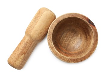 Photo of Wooden mortar with pestle isolated on white, top view