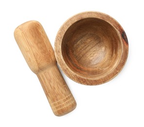 Photo of Wooden mortar with pestle isolated on white, top view