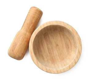Photo of Wooden mortar with pestle isolated on white, top view