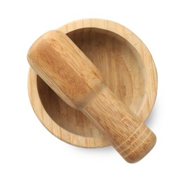 Photo of Wooden mortar with pestle isolated on white, top view