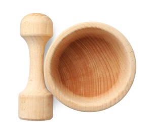 Photo of Wooden mortar with pestle isolated on white, top view