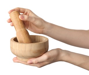 Photo of Woman with mortar and pestle on light background, closeup