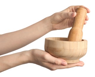 Photo of Woman with mortar and pestle on light background, closeup