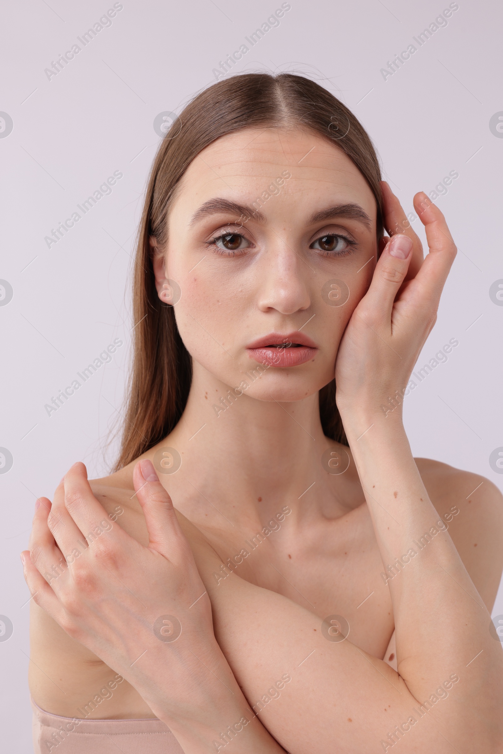 Photo of Portrait of attractive young woman on white background