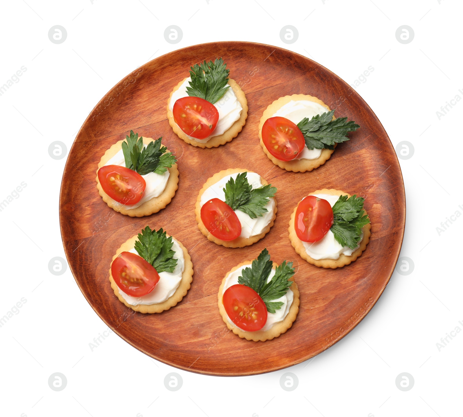 Photo of Tasty crackers with cream cheese, tomatoes and parsley isolated on white, top view