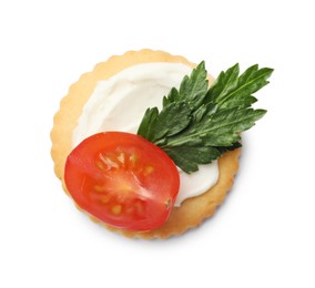 Photo of One tasty cracker with cream cheese, tomato and parsley isolated on white, top view