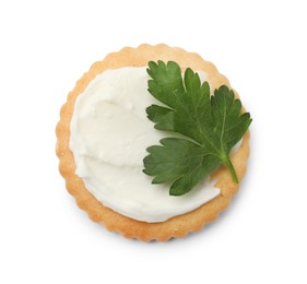 Photo of One tasty cracker with cream cheese and parsley isolated on white, top view