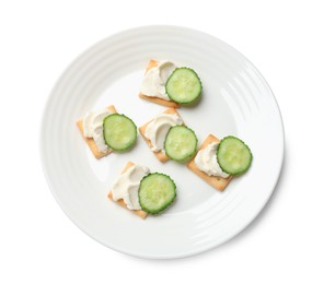Photo of Tasty crackers with cream cheese and cucumber isolated on white, top view