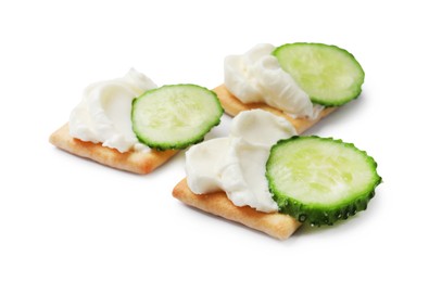 Photo of Tasty crackers with cream cheese and cucumber isolated on white