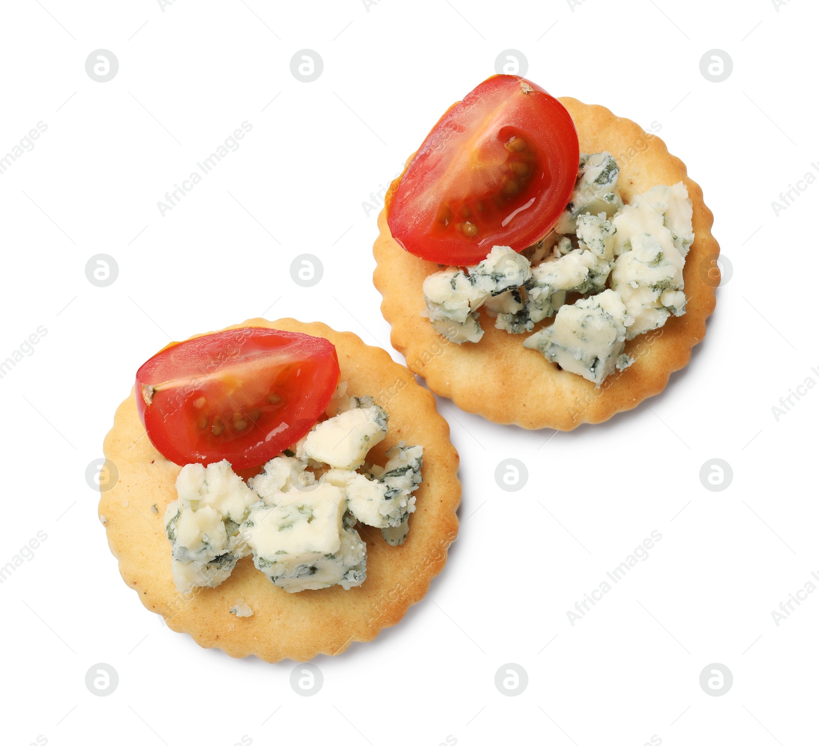 Tasty crackers with blue cheese and tomatoes isolated on white, top view Photo of Tasty crackers with blue cheese and tomatoes isolated on white, top view