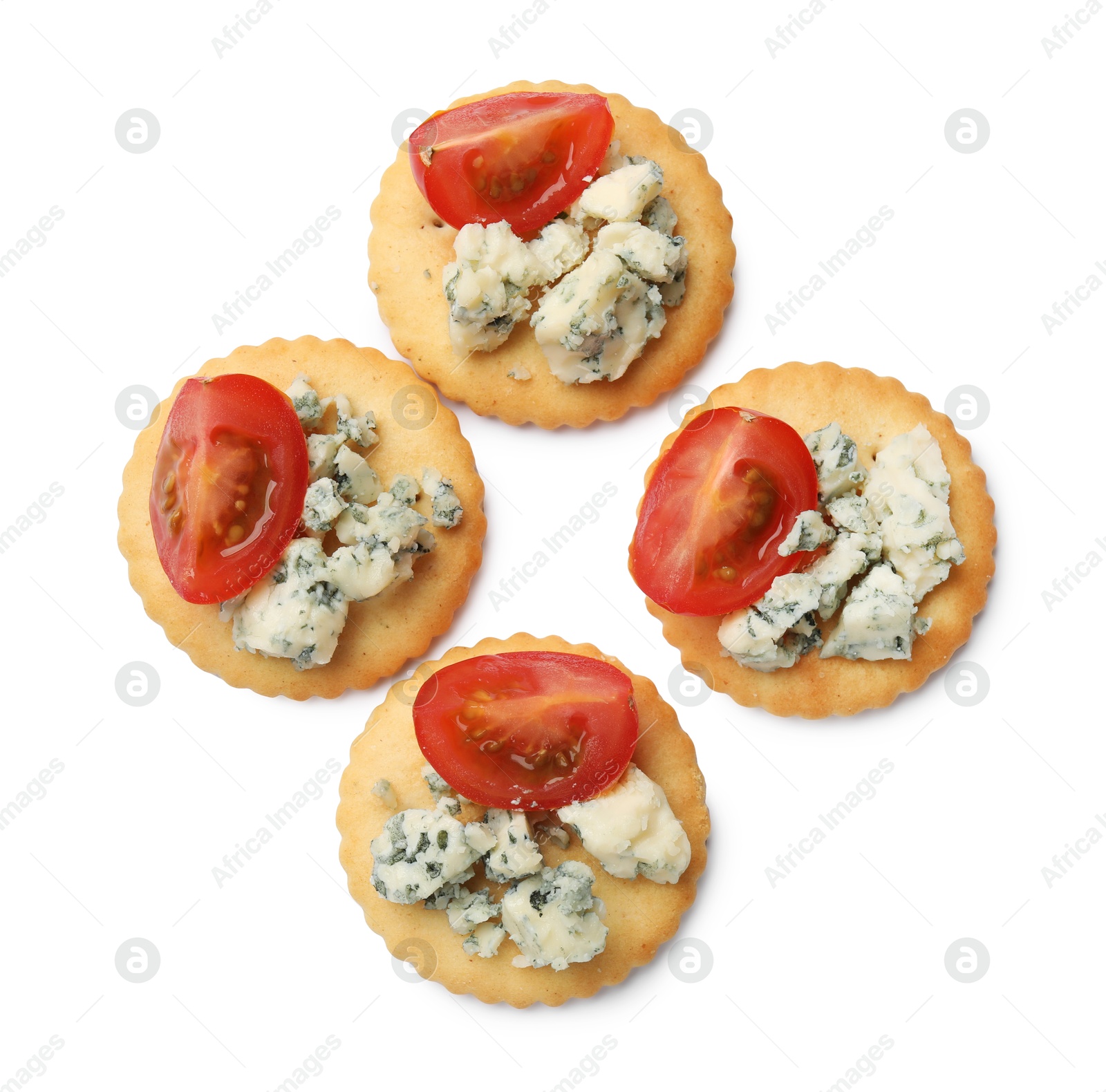Tasty crackers with blue cheese and tomatoes isolated on white, top view Photo of Tasty crackers with blue cheese and tomatoes isolated on white, top view