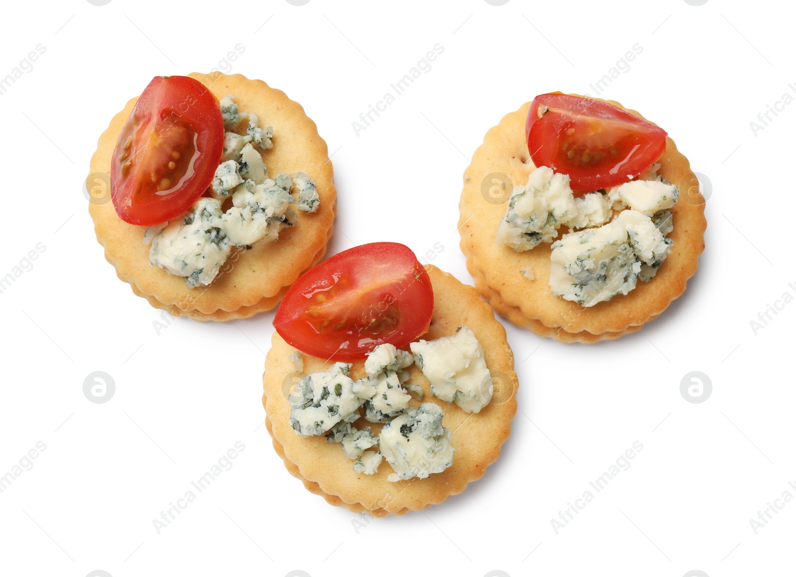 Tasty crackers with blue cheese and tomatoes isolated on white, top view Photo of Tasty crackers with blue cheese and tomatoes isolated on white, top view