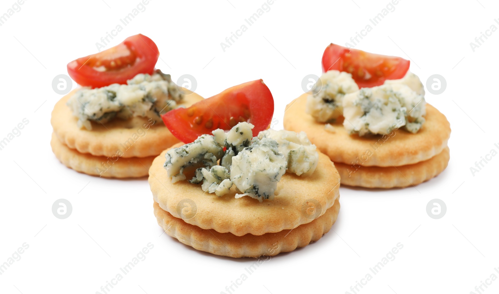 Tasty crackers with blue cheese and tomatoes isolated on white Photo of Tasty crackers with blue cheese and tomatoes isolated on white
