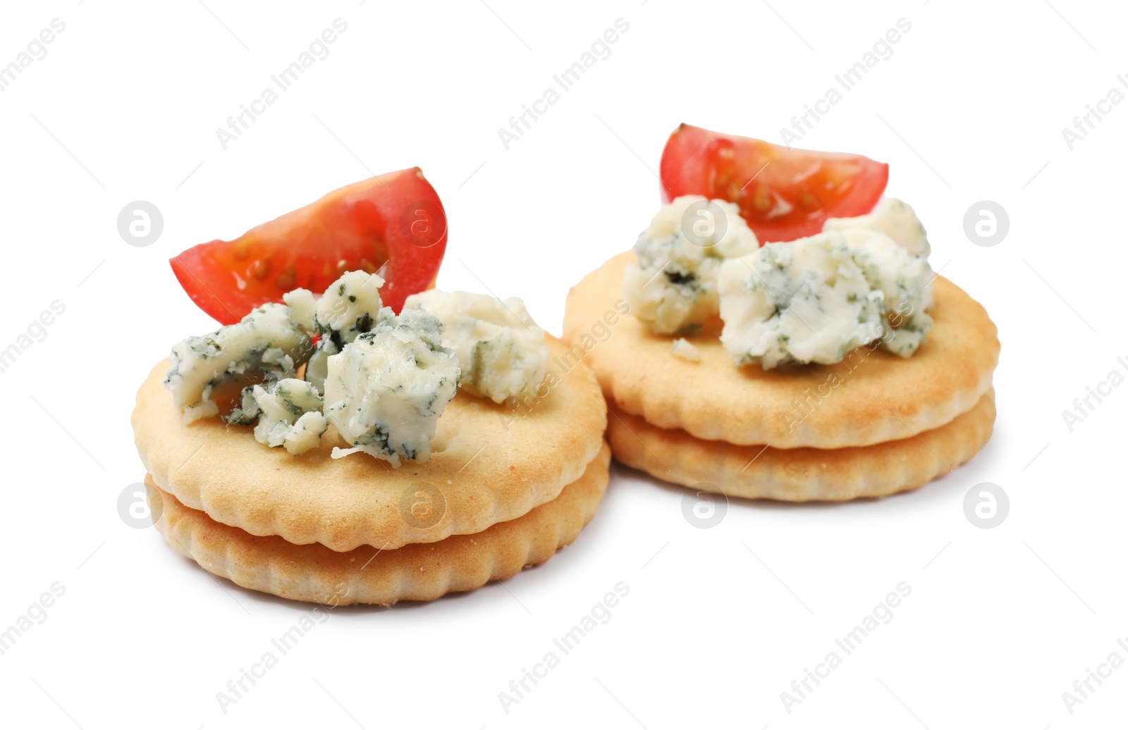 Tasty crackers with blue cheese and tomatoes isolated on white Photo of Tasty crackers with blue cheese and tomatoes isolated on white