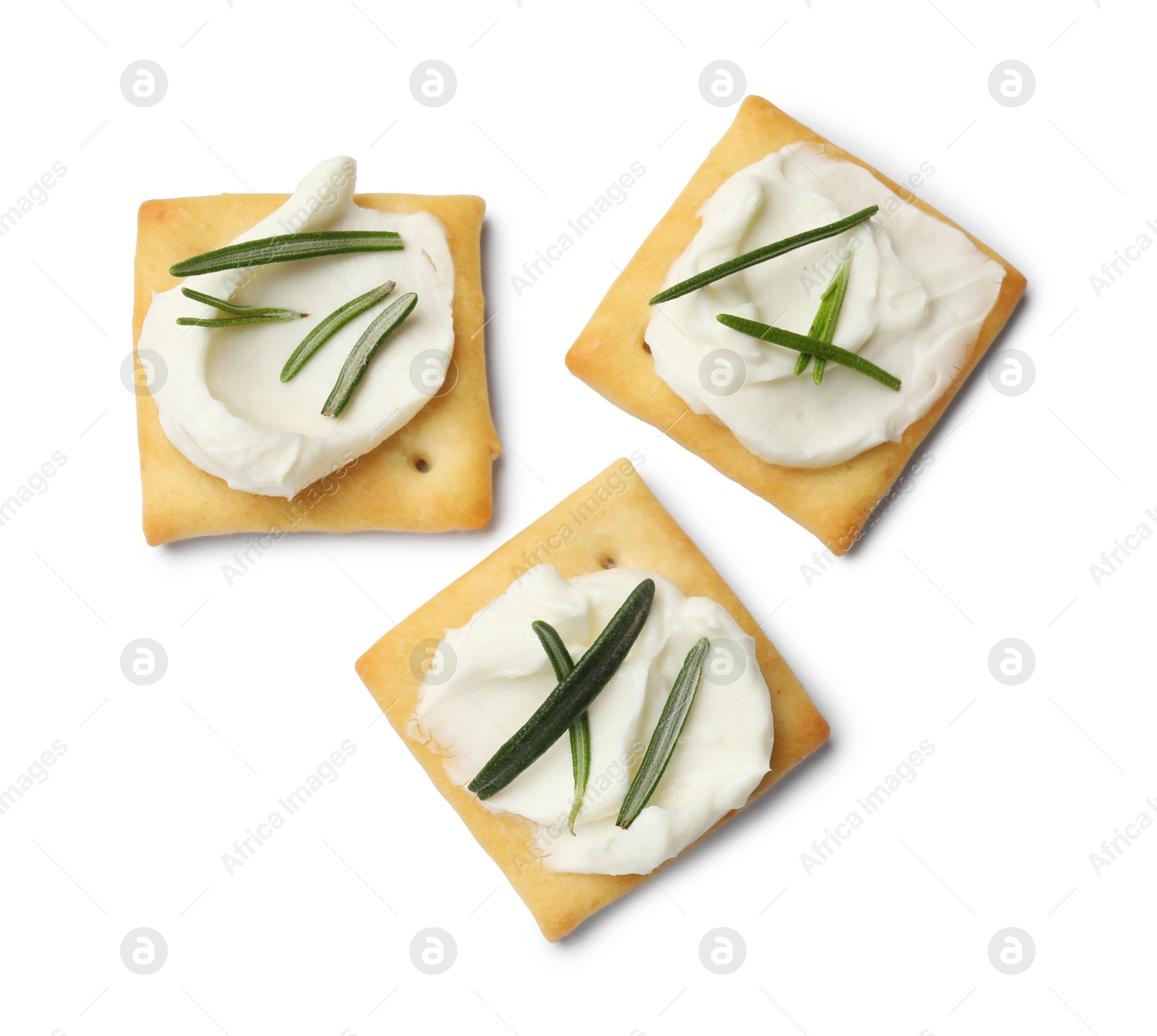 Tasty crackers with cream cheese and rosemary isolated on white, top view Photo of Tasty crackers with cream cheese and rosemary isolated on white, top view