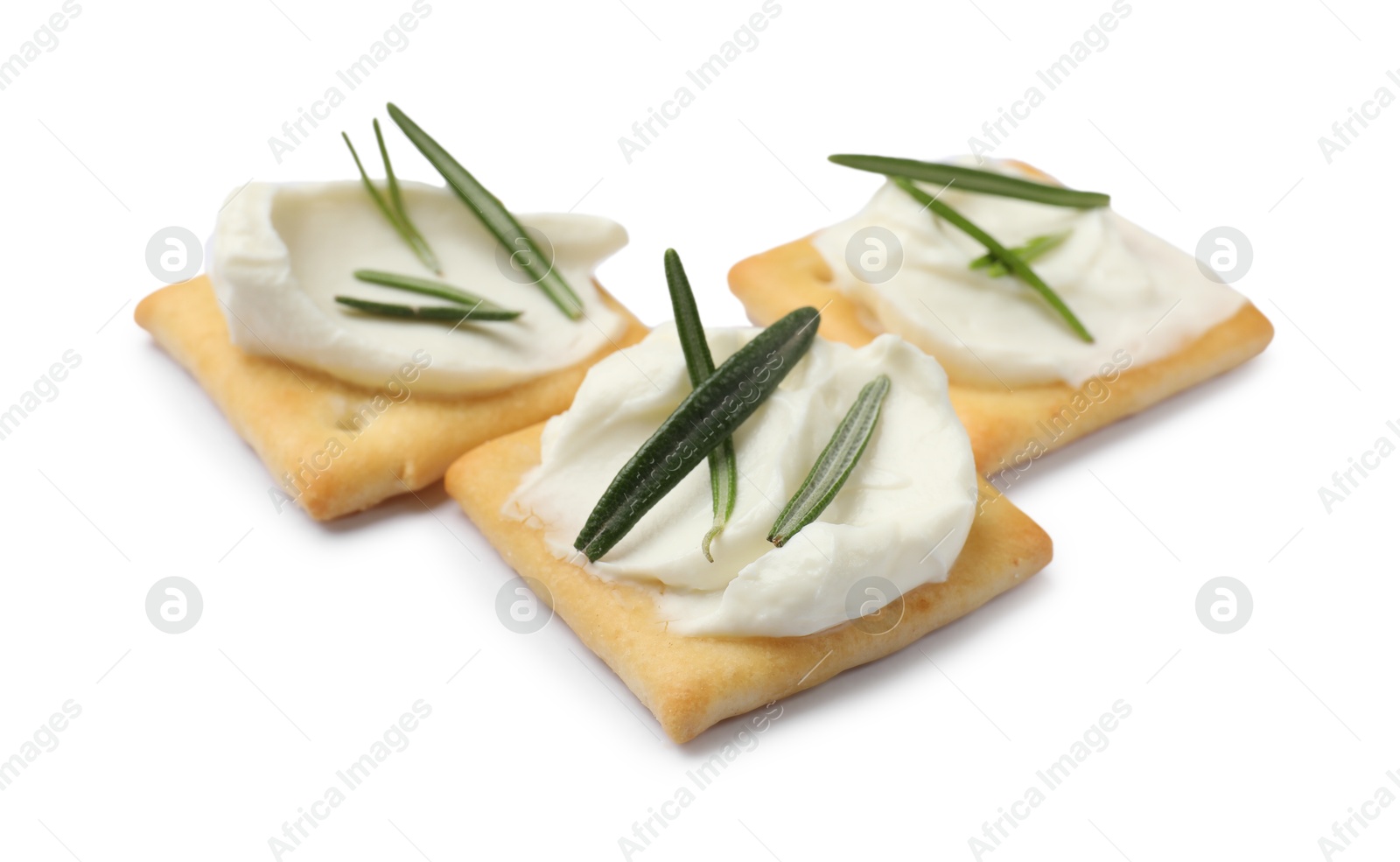 Tasty crackers with cream cheese and rosemary isolated on white Photo of Tasty crackers with cream cheese and rosemary isolated on white