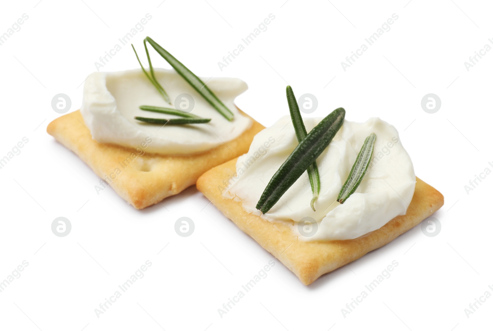 Tasty crackers with cream cheese and rosemary isolated on white Photo of Tasty crackers with cream cheese and rosemary isolated on white