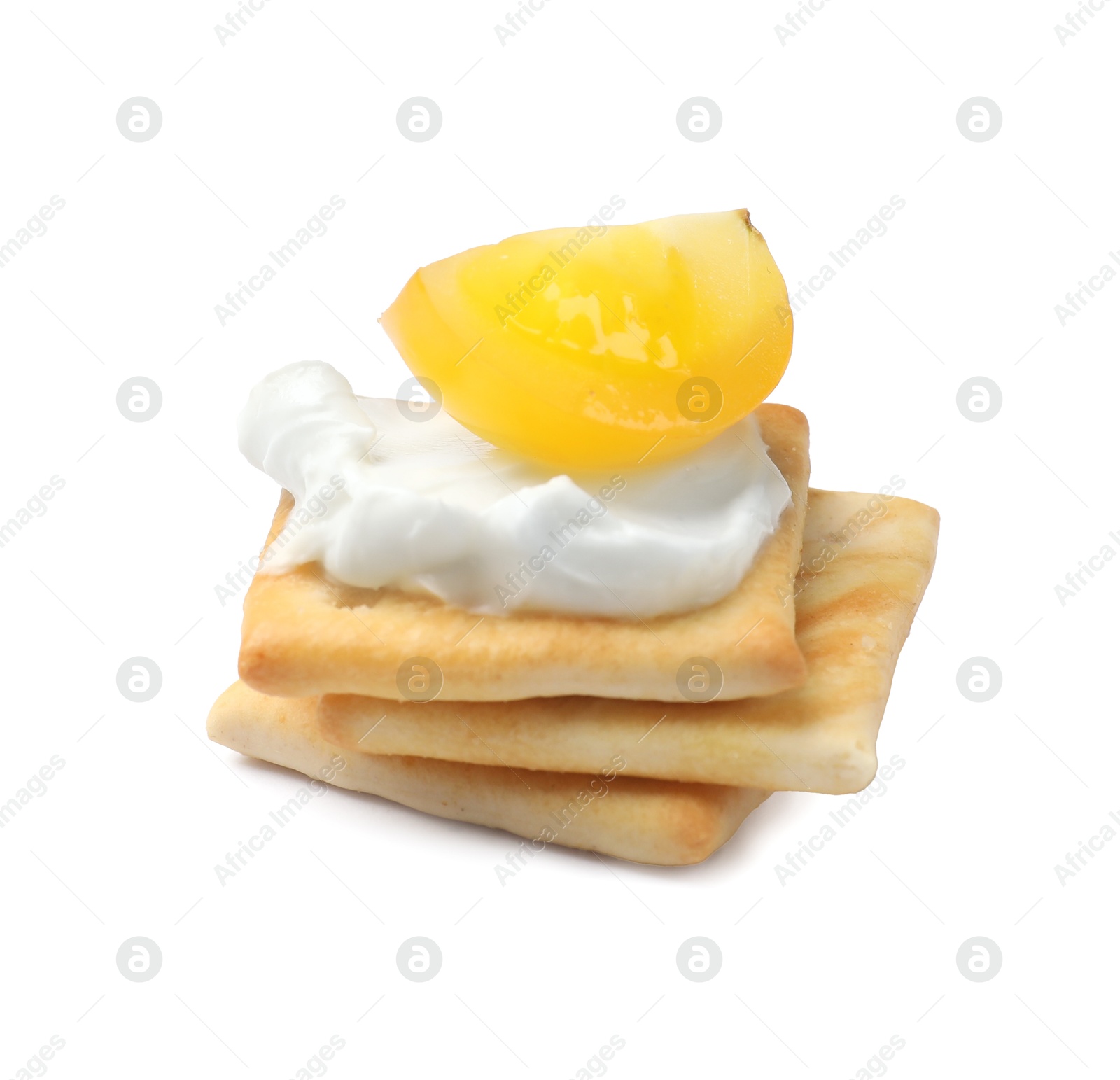 Stack of tasty crackers with cream cheese and tomato isolated on white Photo of Stack of tasty crackers with cream cheese and tomato isolated on white