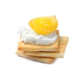 Photo of Stack of tasty crackers with cream cheese and tomato isolated on white