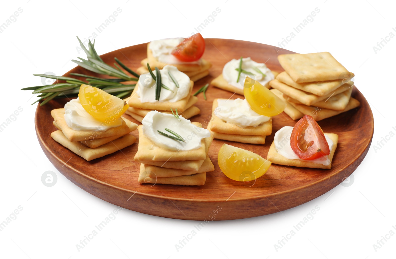 Tasty crackers with cream cheese, rosemary and tomatoes isolated on white Photo of Tasty crackers with cream cheese, rosemary and tomatoes isolated on white