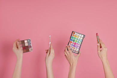 Photo of Women with different cosmetic products on pink background, closeup. Space for text