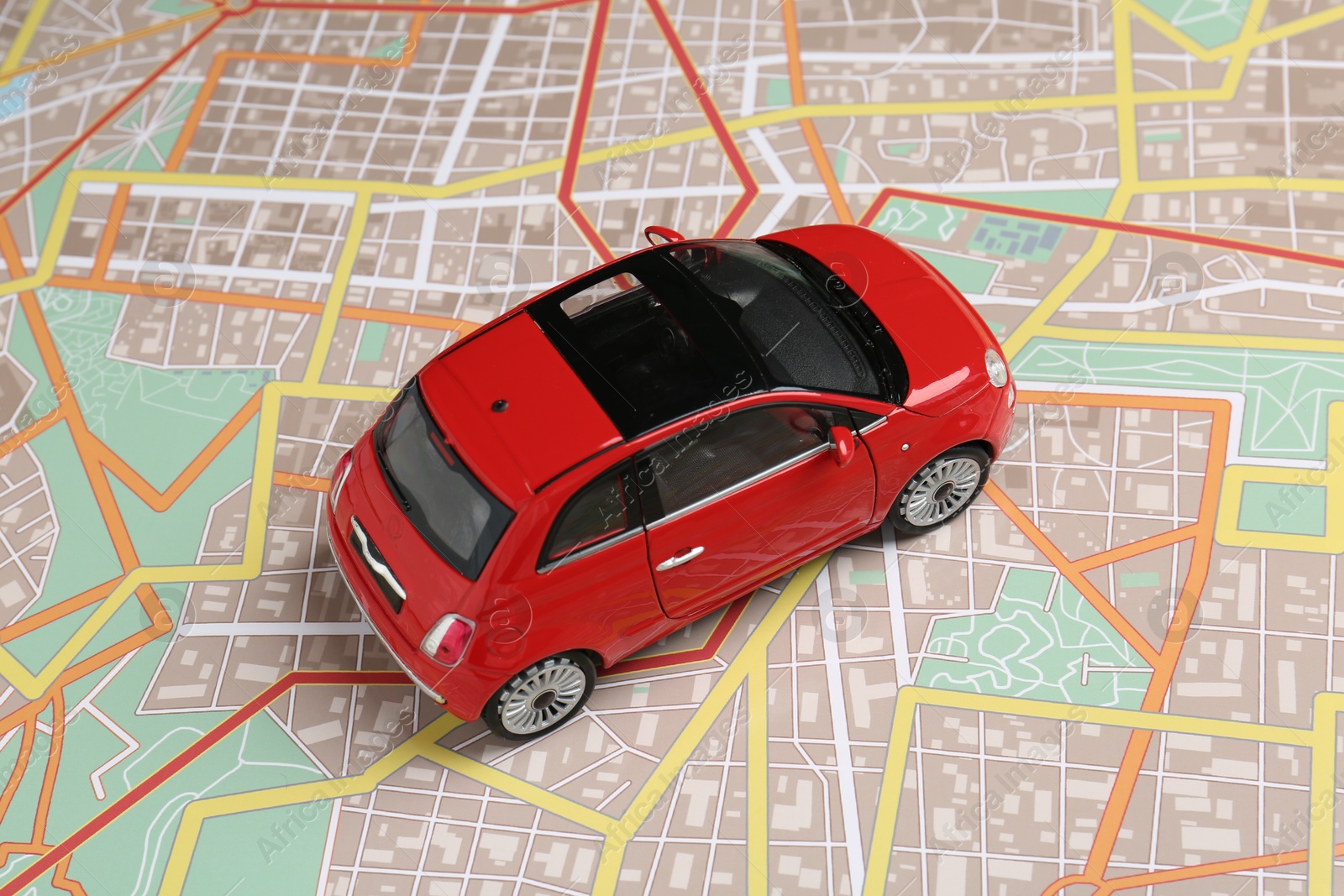 Road trip concept. Car model on city map Photo of Road trip concept. Car model on city map