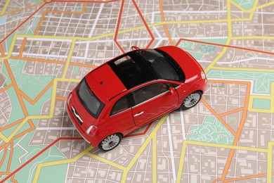 Photo of Road trip concept. Car model on city map