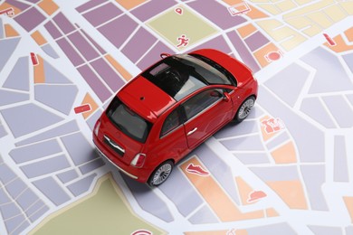 Photo of Road trip concept. Car model on city map