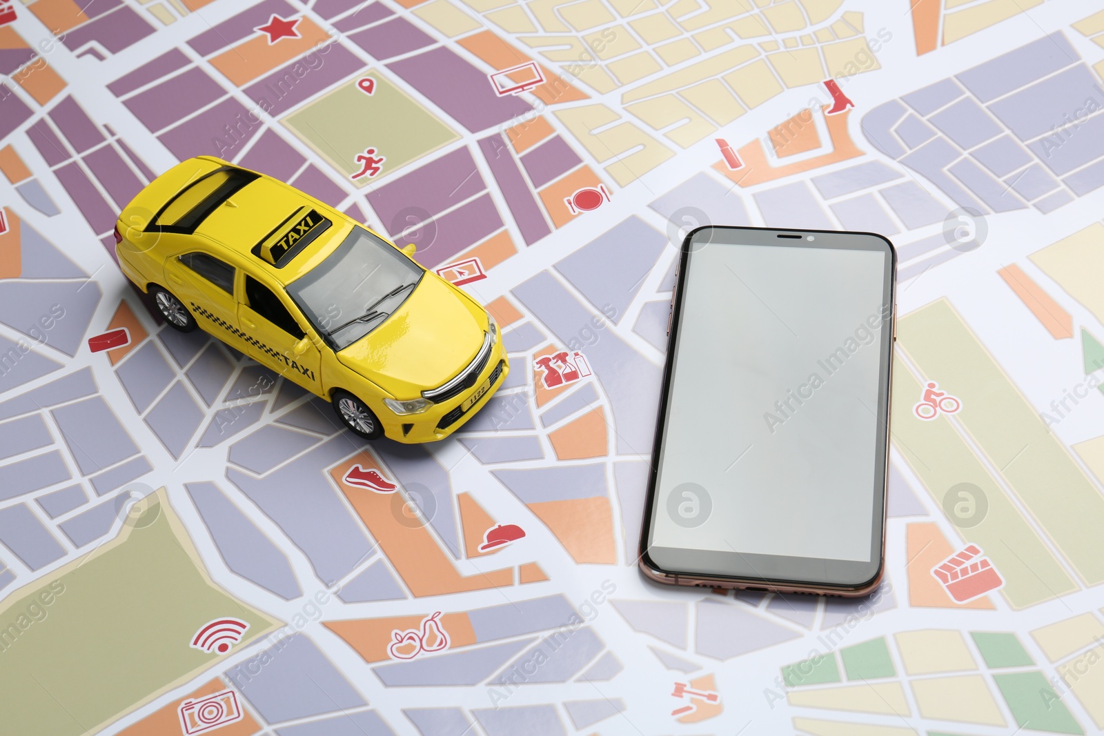 Road trip concept. Smartphone and car model on city map Photo of Road trip concept. Smartphone and car model on city map