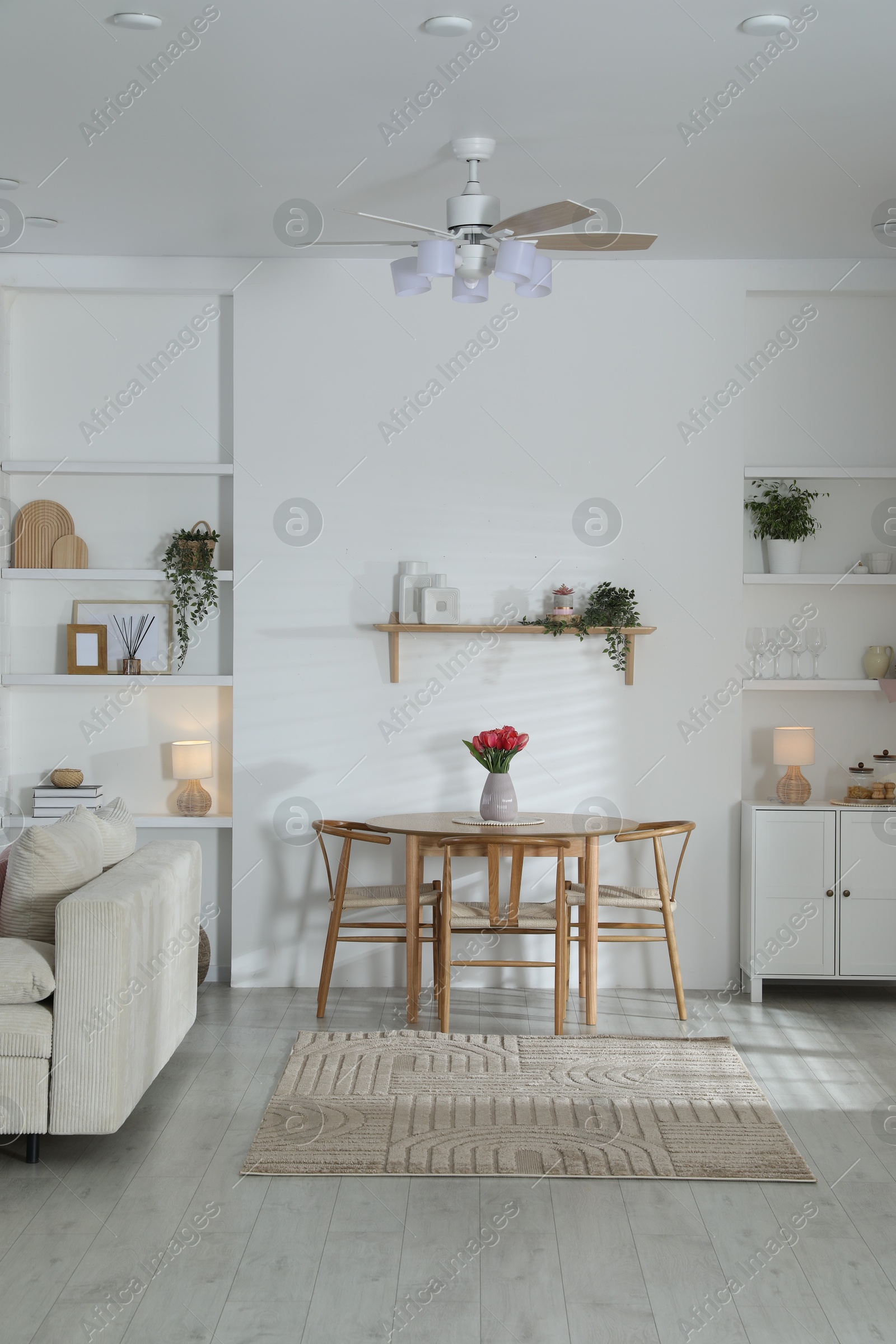 Stylish dining table with chairs in room. Interior design Photo of Stylish dining table with chairs in room. Interior design