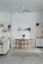 Photo of Stylish dining table with chairs in room. Interior design