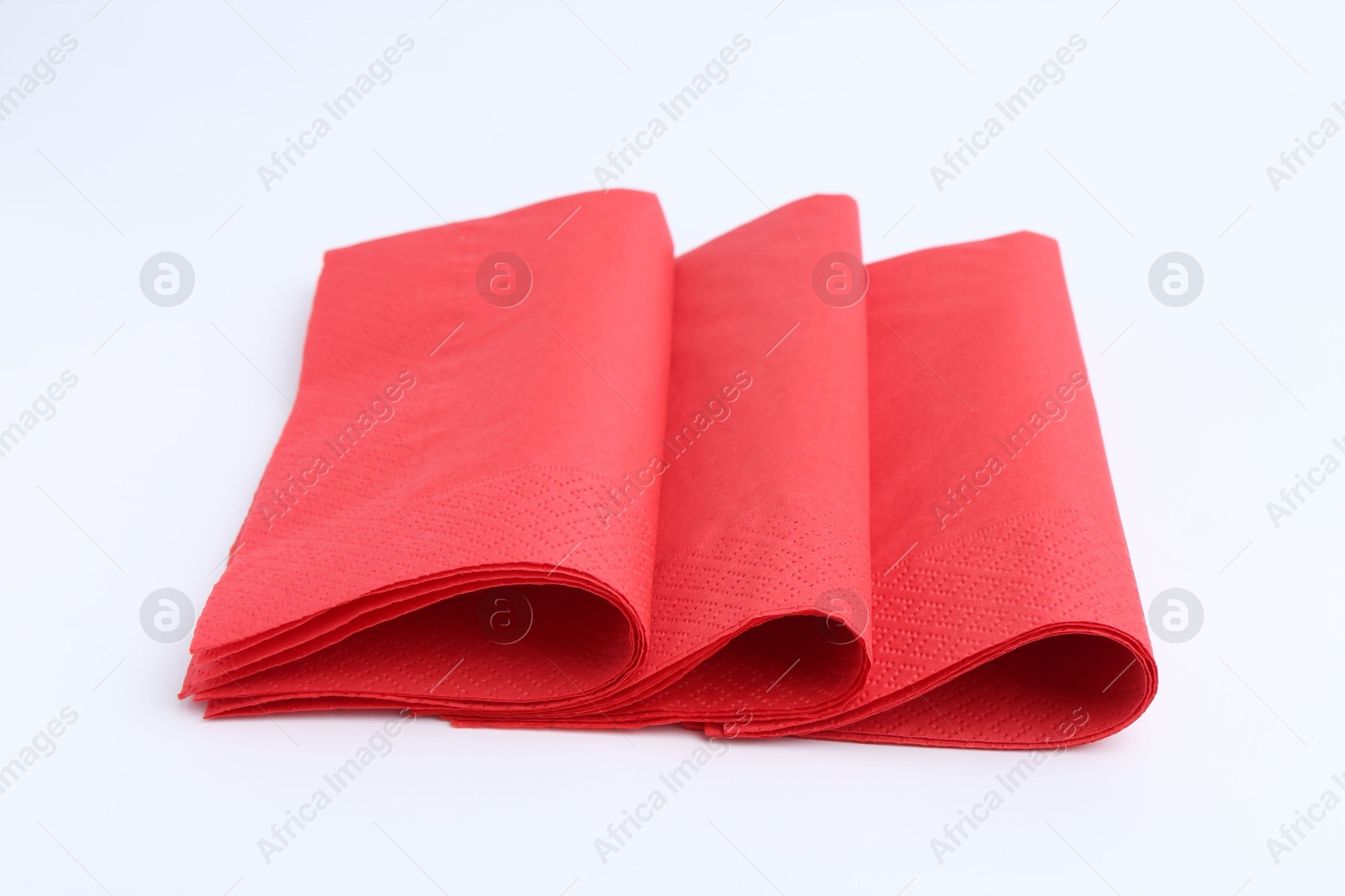 Many red paper handkerchiefs isolated on white Photo of Many red paper handkerchiefs isolated on white