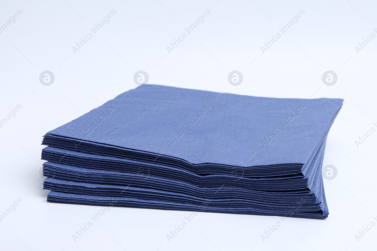 Many blue paper handkerchiefs isolated on white Photo of Many blue paper handkerchiefs isolated on white