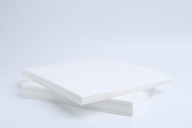 Photo of Stack of paper handkerchiefs isolated on white