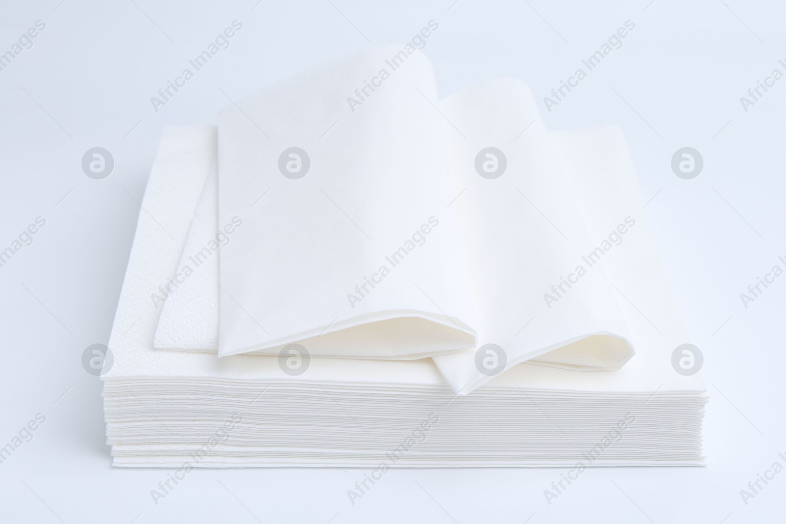 Stack of paper handkerchiefs isolated on white Photo of Stack of paper handkerchiefs isolated on white