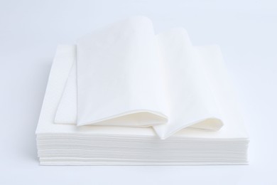 Photo of Stack of paper handkerchiefs isolated on white