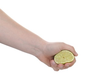 Photo of Woman squeezing lime on white background, closeup