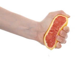 Photo of Woman squeezing grapefruit on white background, closeup