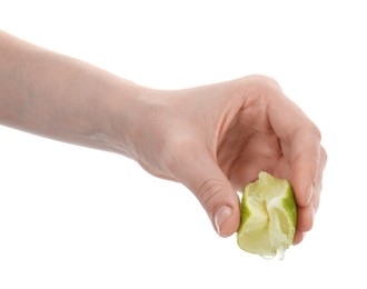 Photo of Woman squeezing lime on white background, closeup