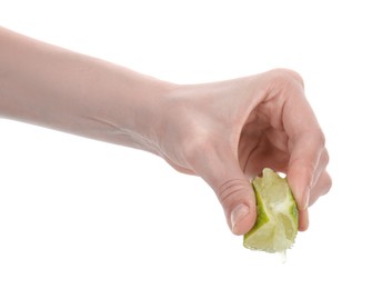 Photo of Woman squeezing lime on white background, closeup