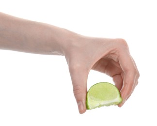Photo of Woman squeezing lime on white background, closeup