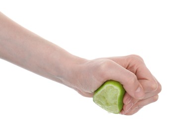 Photo of Woman squeezing lime on white background, closeup