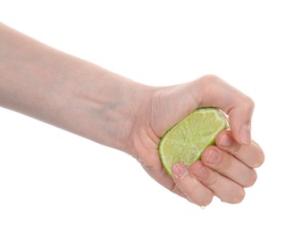 Photo of Woman squeezing lime on white background, closeup