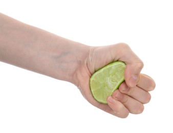 Photo of Woman squeezing lime on white background, closeup
