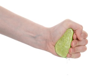 Photo of Woman squeezing lime on white background, closeup