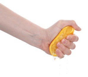 Photo of Woman squeezing orange on white background, closeup