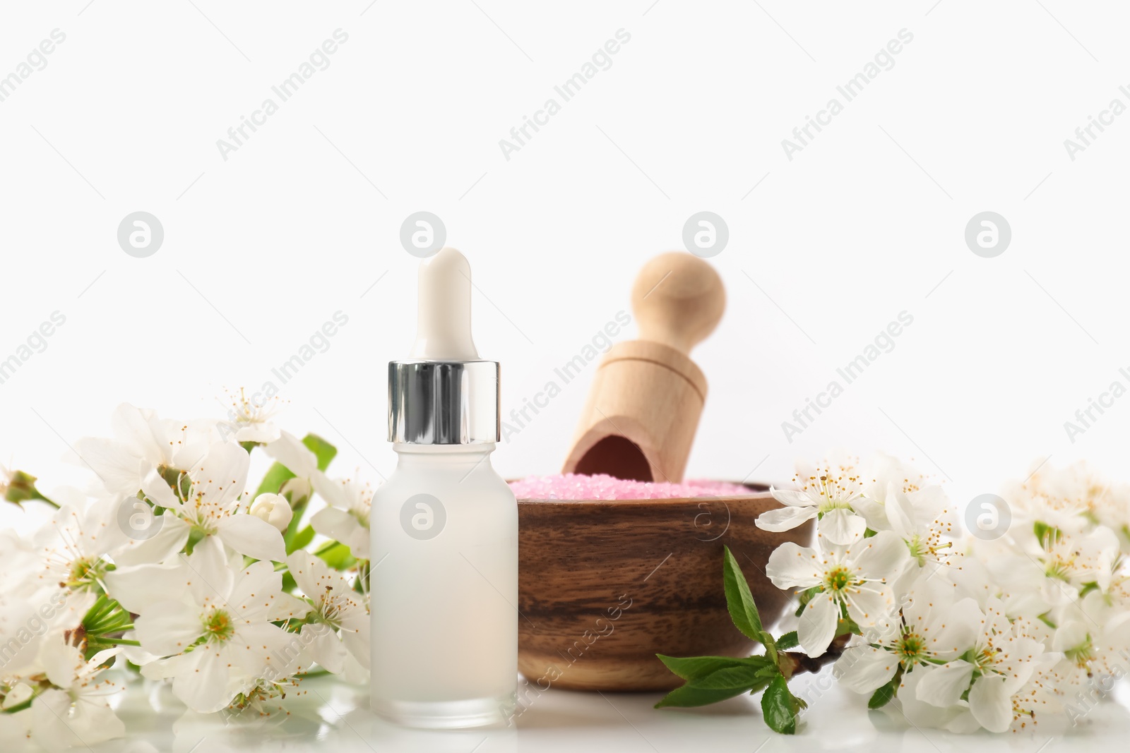 Spa composition with cosmetic products and beautiful flowers on white background, closeup Photo of Spa composition with cosmetic products and beautiful flowers on white background, closeup
