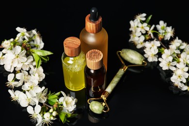 Photo of Spa composition with cosmetic products and beautiful flowers on black mirror surface, closeup