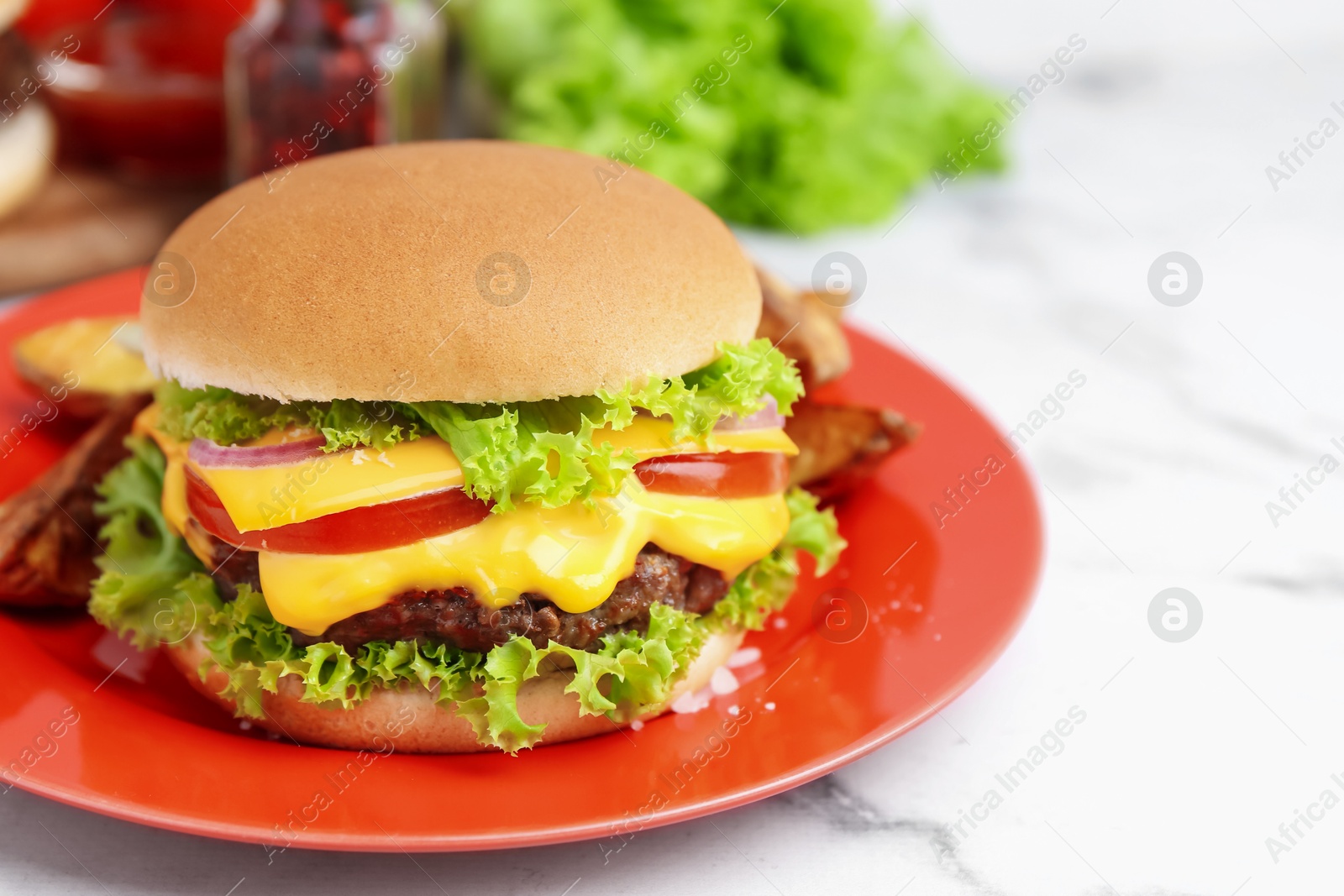 Tasty cheeseburger on white marble table, closeup Photo of Tasty cheeseburger on white marble table, closeup