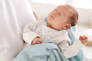 Photo of Father with his cute newborn baby indoors, closeup